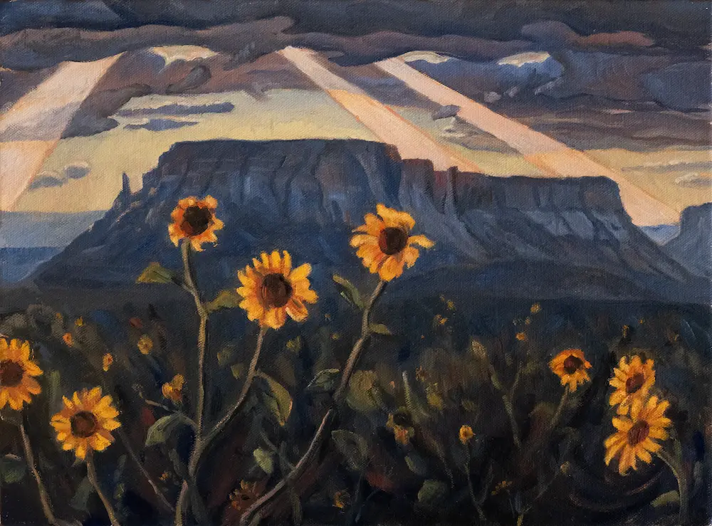 Painting of sunflowers with a red rock bluff in the background with dark clouds and the sun breaking through with a few beams of light.