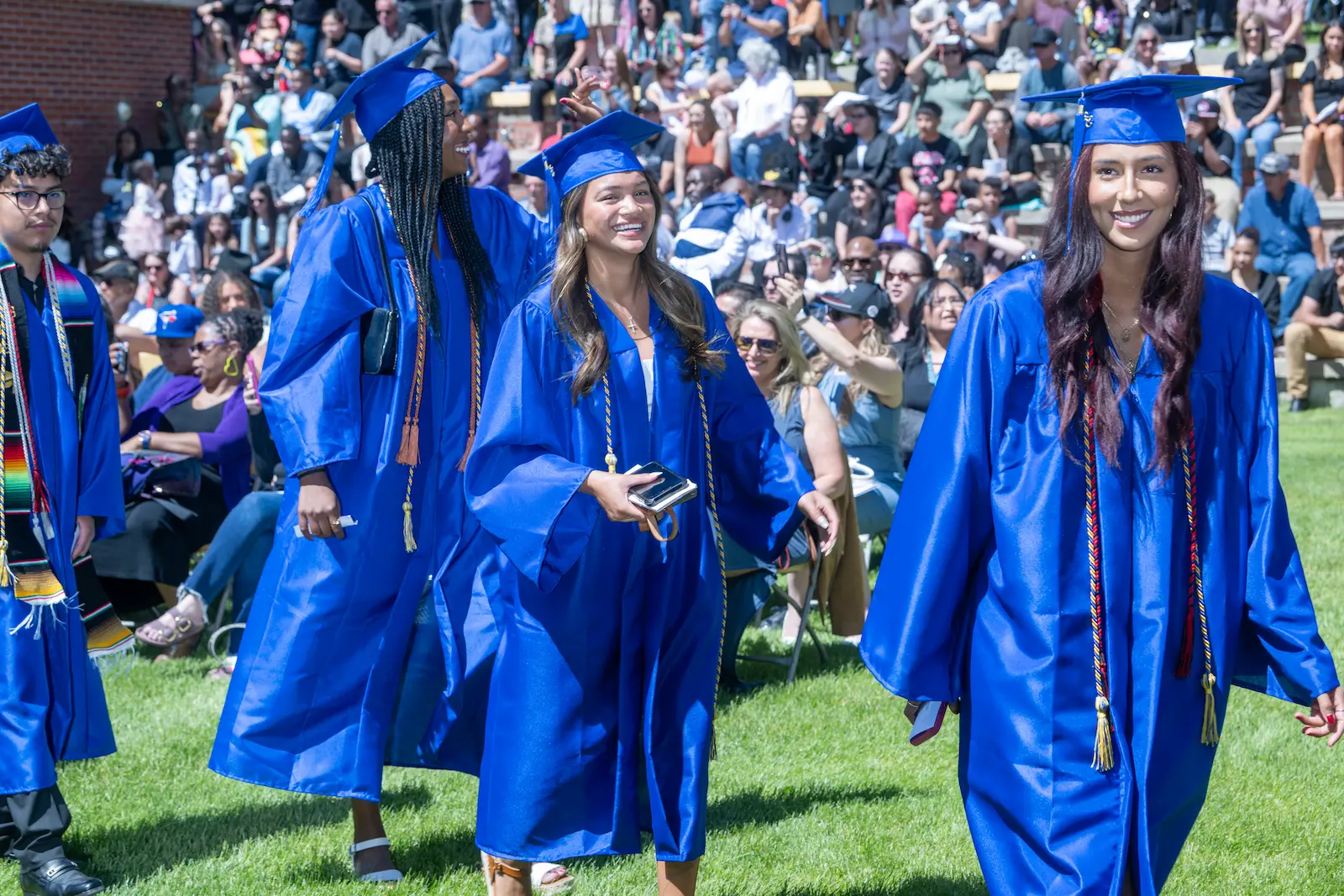Smiling graduates in cap and gown at 2025 Trinidad State College graduation ceremony