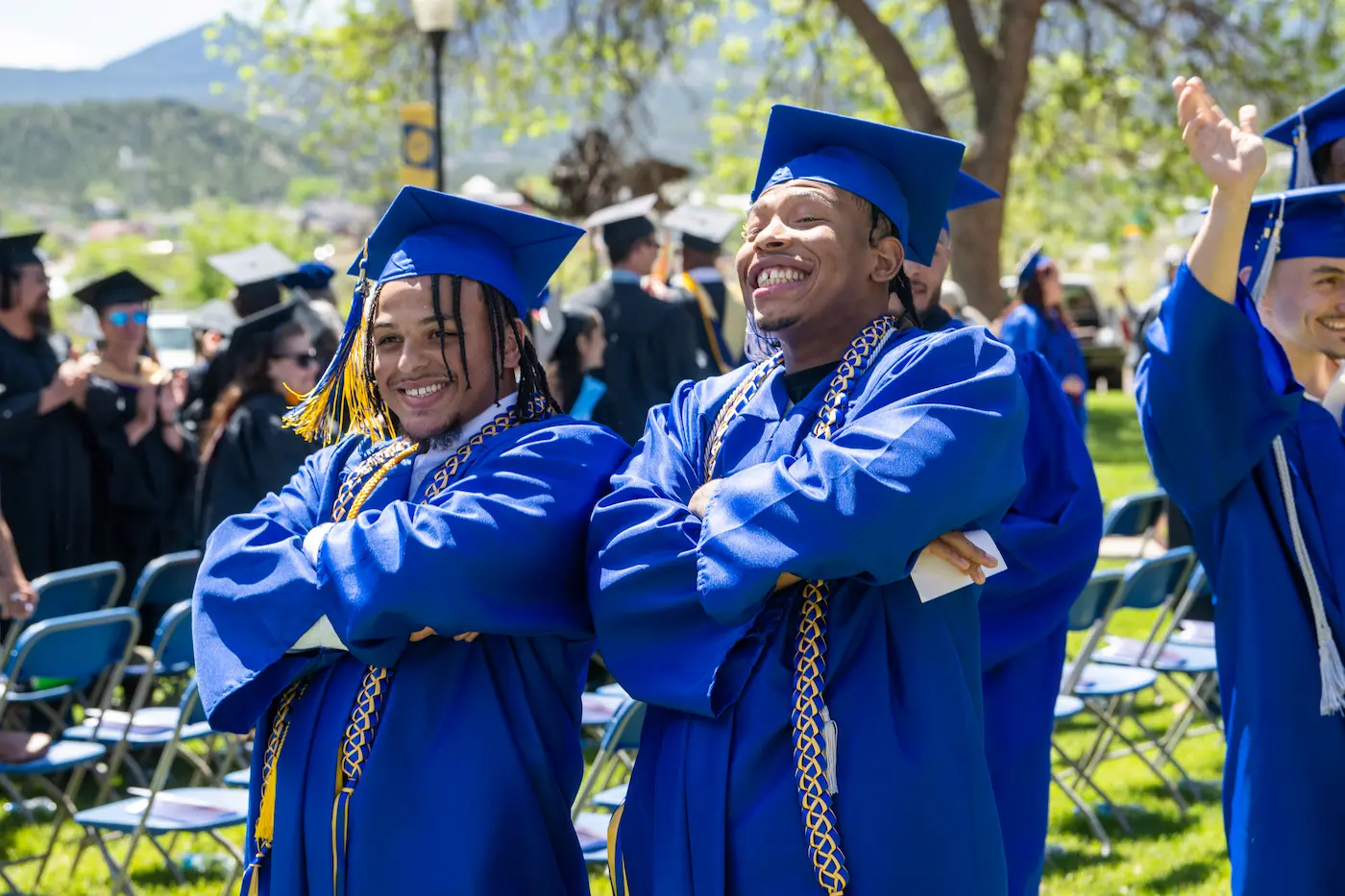Smiling graduates in cap and gown at 2025 Trinidad State College graduation ceremony